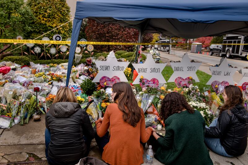 Mourners gather at an impromptu memorial for victims of the Tree of Life synagogue shooting in Pittsburgh, in November, 2018. Photograph: Hilary Swift/New York Times
                      