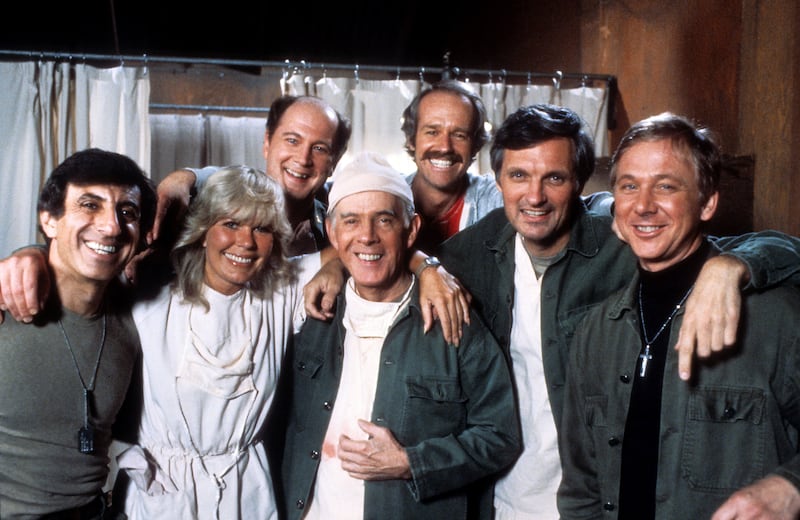 Jamie Farr, Loretta Swit, David Ogden Stiers, Harry Morgan, Mike Farrell, Alan Alda, and William Christopher in publicity portrait for the film 'M*A*S*H', Circa 1978. Photograph: 20th Century-Fox TV/Getty Images