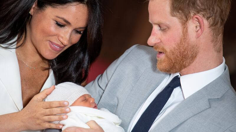 Britain’s Prince Harry and Meghan, Duchess of Sussex hold their baby son. Photograph: Dominic Lipinski/Pool via Reuters