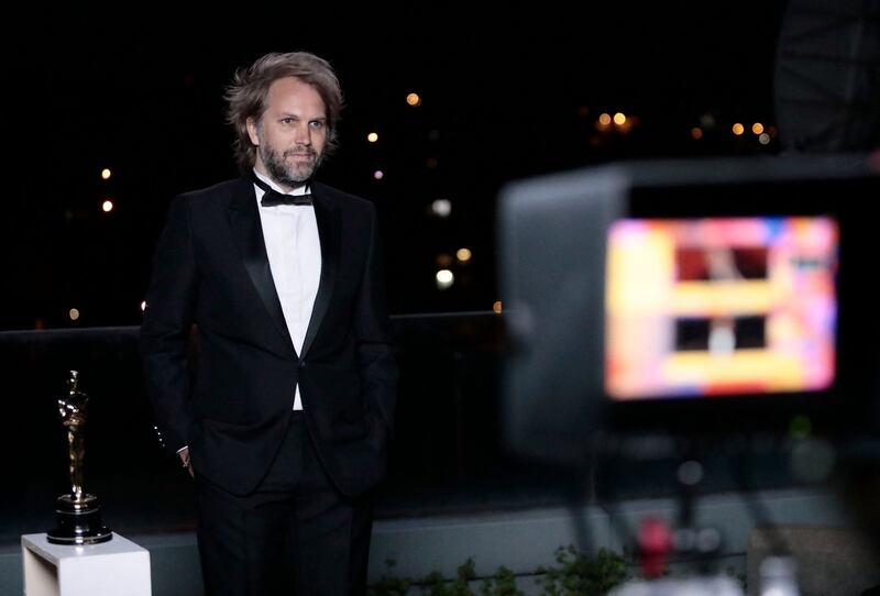 French novelist Florian Zeller is interviewed after winning the Best Adapted Screenplay for the "The Father" at a screening of the Oscars early on April 26, 2021 in Paris, France. (Photo by Lewis Joly / POOL / AFP) (Photo by LEWIS JOLY/POOL/AFP via Getty Images)