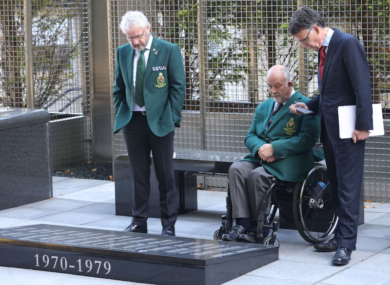 Former RUC and PSNI serving officers Ronnie Galwey and Michael Wilson, and Mark Hennessy of The Irish Times, at the RUC Memorial Garden at PSNI Headquarters in Belfast. All photographs: Stephen Davison/Pacemaker