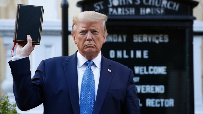 US president Donald Trump holds a Bible outside St John’s Church across Lafayette Park from the White House amide protests in June.  Patrick Semansky/AP Photo