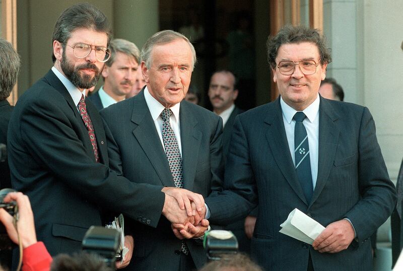 6th September 1994. An Taoiseach Albert Reynolds shakes hands with Sinn Fein leader Gerry Adams and SDLP leader John Hume outside Government Buildings after a discussion of ways to advance the peace process following the IRA's ceasefire announcement of August 31st. Photograph: Matt Kavanagh/The Irish Times