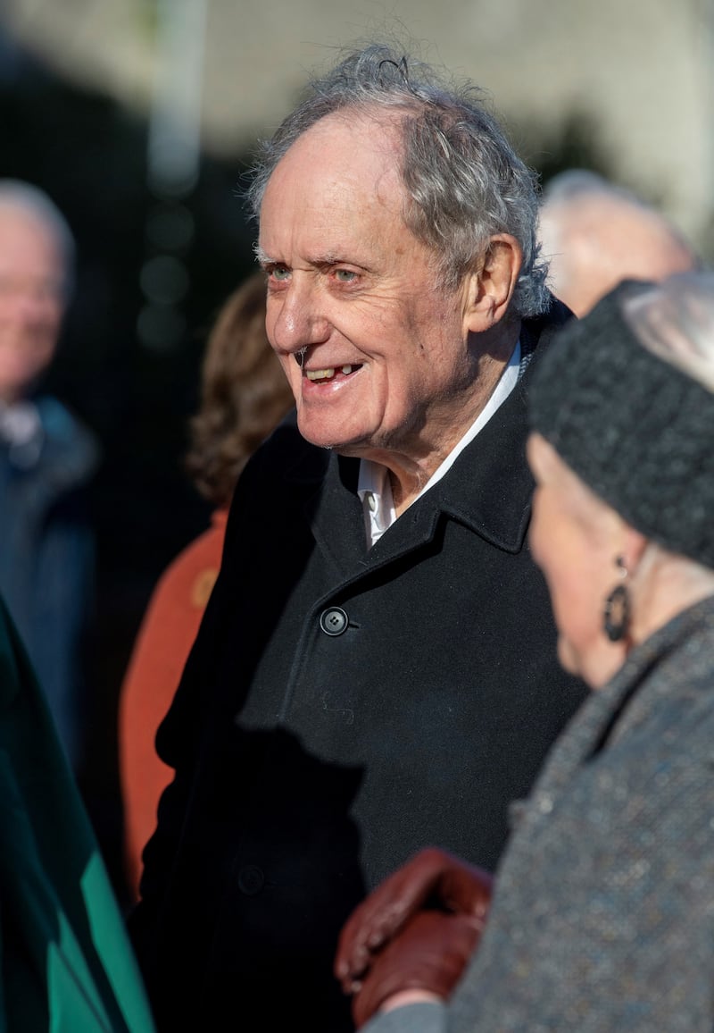 Vincent Browne, journalist and columnist, chats to other mourners