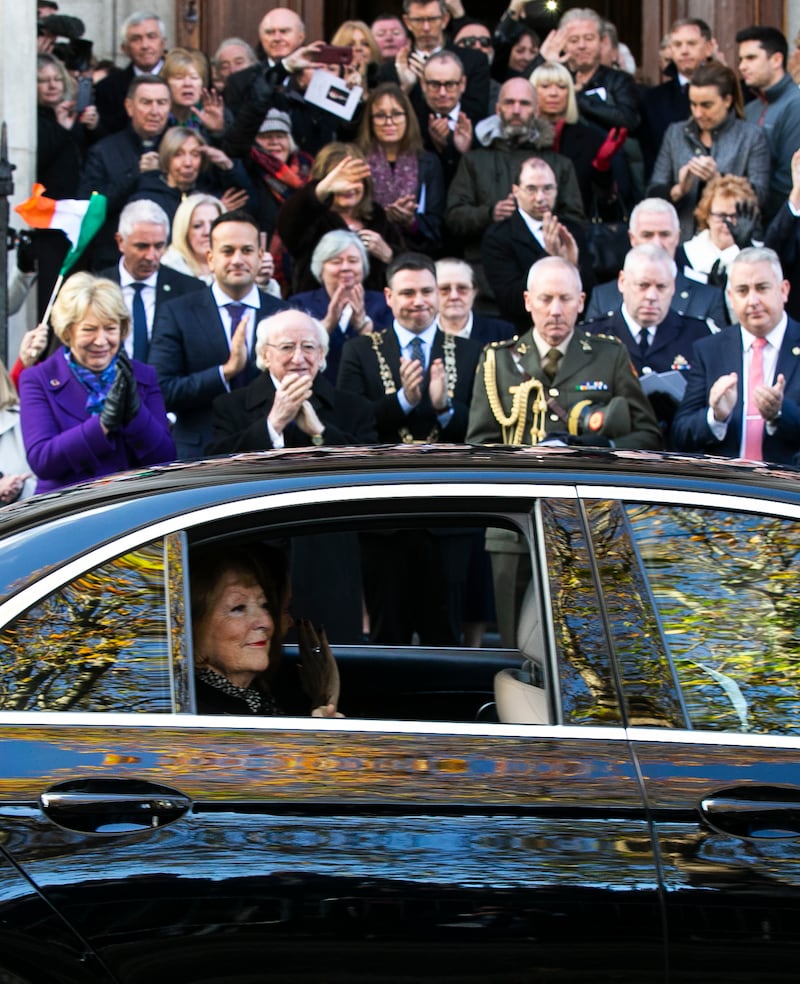 The late Kathleen Watkins waves to the crowds as her husband Gay Byrne's funeral cortege passes President Michael D Higgins and others outside the Pro Cathedral in Dublin in November 2019. Photograph: Sam Boal/ RollingNews.ie