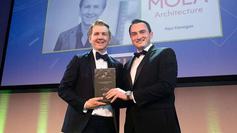 Dave Merriman, Director, T&I Fitouts presents the Young Fit Out Designer of the Year award to Paul Finnegan, MOLA Architecture