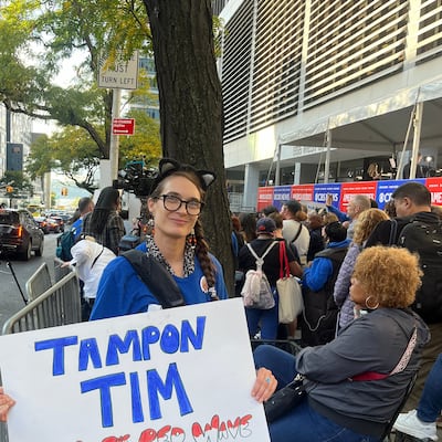 Tim Walz supporter Clarissa Lynn with her 'Tampon Tim' poster ahead of the vice-presidential debate in New York. Photograph: Keith Duggan