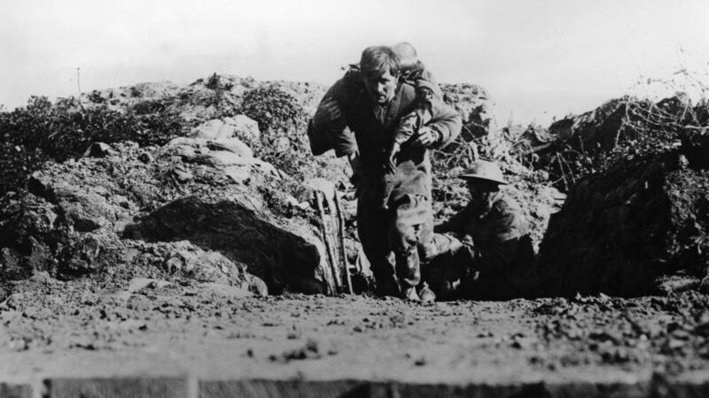 Bringing in the wounded of the 1st Bedfordshire Regiment after the assault on the first day of the Battle of the Somme, July 1st, 1916. Photograph: The Art Archive / Imperial War Museum