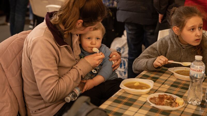 A woman feeds her baby in a reception tent after arriving at an evacuation point in Zaporizhzhia   for people fleeing the Azovstal plant, Mariupol. Photograph: Chris McGrath/Getty Images