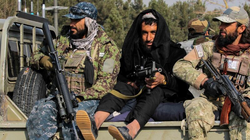 A Taliban patrol on Tuesday during a protest by Afghans outside the building of the former US embassy in Kabul, demanding that the US  unfreeze Afghan assets. Photograph: EPA