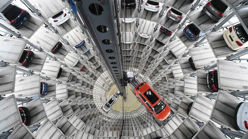 A VW Golf and Passat are loaded in a delivery tower at the Volkswagen plant  in Wolfsburg. Photograph: Fabian Bimmer/Reuters