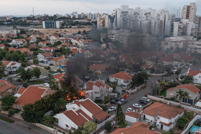 Smoke rises after a rocket fired from the Gaza Strip hit a house in Ashkelon, southern Israel. Photograph: Tsafrir Abayov/AP