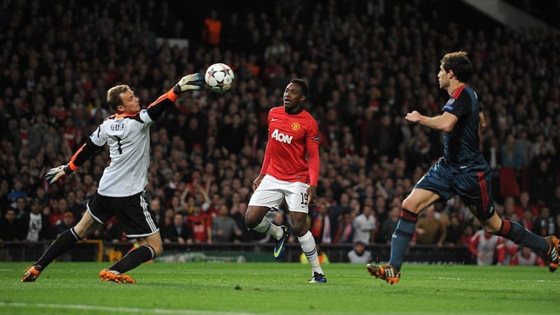 Bayern Munich’s goalkeeper Manuel Neuer (left) saves Danny Welbeck’s shot during the first half. Photo: Martin Rickett/PA Wire