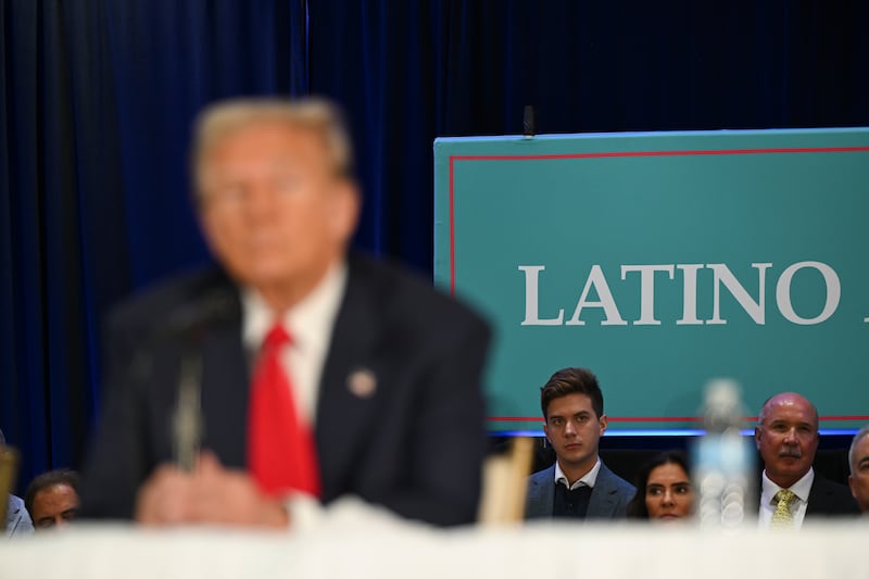 People listen as Donald Trump attends a roundtable discussion with Latino leaders in Doral, Florida. Photograph: Kenny Holston/The New York Times