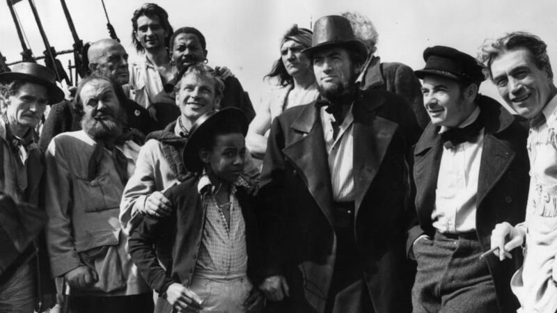 The theme of insanity pervades Herman Melville’s epic sea voyage in Moby Dick, gripping characters such as Captain Ahab, portrayed here, centre, by Gregory Peck in the film by John Huston, right. Photograph: Fox Photos/Getty Images