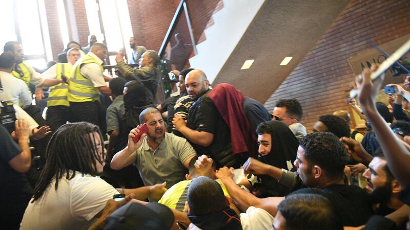 Protestors invade Kensington Town Hall  following the fire at Grenfell Tower. Photograph:  Facundo Arrizabalaga