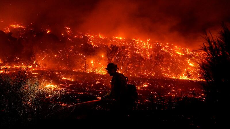 A wildfire in Silverado, California, in December. Joe Biden has indicated that he wants to embed climate-change priorities throughout the federal government. Photograph: Kent Nishimura/Los Angeles Times via Getty Images