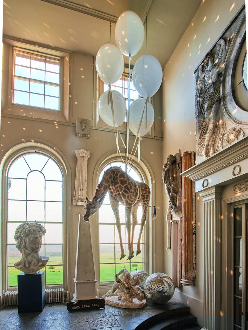 The famous Flying Giraffe, a real preserved animal hanging from crystal balloons in the orangery