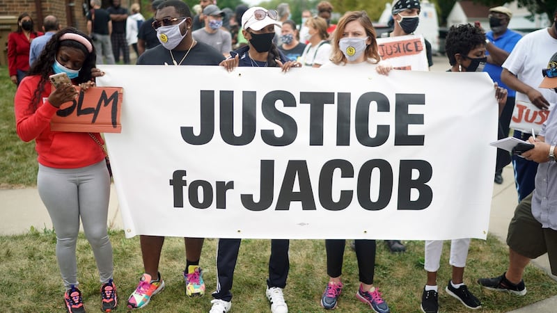 Protesters gather near the site where Jacob Blake was shot by police in Kenosha, Wisconsin. Photograph: Chang W Lee/The New York Times