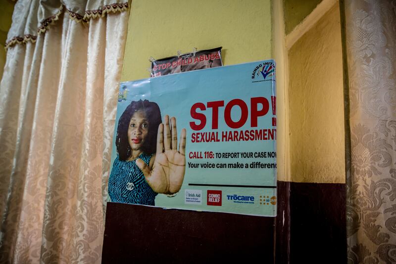 A sign on the wall of Rainbo Centre, Freetown, which gives information about a hotline for victims of sexual violence. Photograph: Sally Hayden