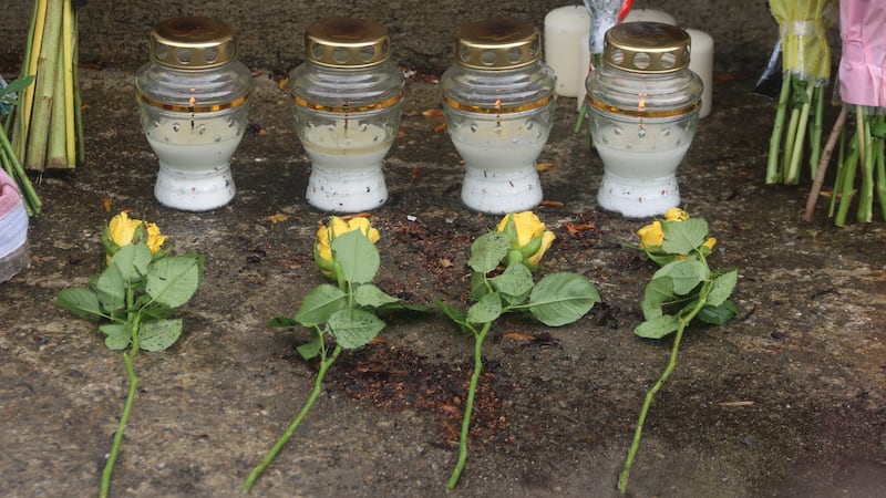 Four yellow roses have been left beside four candles to remember the victims of Friday's road crash in Clonmel.