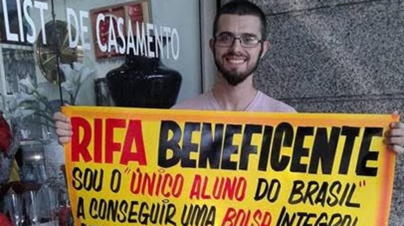 Ricardo Filho made a sign – which said ‘I’m the only student in Brazil who got the tuition fees scholarship to do my masters in Dublin, it’s my dream, please help me – and sold raffle tickets in order to come up with the €3,000 needed to secure permission to study in Ireland. Photograph: Ricardo Filho