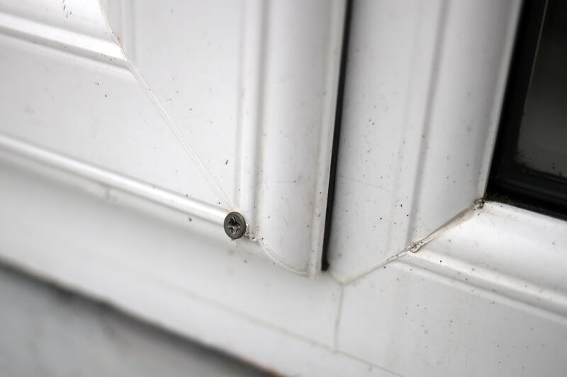 A screw is used to keep a window shut in a home in Kilbarry. Photograph: Chris Maddaloni/The Irish Times