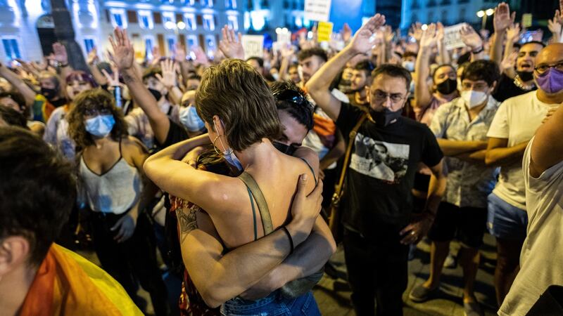 Two people hug each other during a demonstration in Puerta del Sol against aggressions to LGTBI people. Photograph: Marcos del Mazo/LightRocket via Getty Images