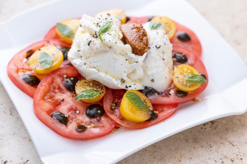 Caprese salad with sundried tomato pesto and pickled walnuts. Photograph: Harry Weir