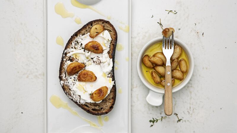 Goat’s cheese and confit garlic on toasted sourdough. Photograph: Harry Weir Photography