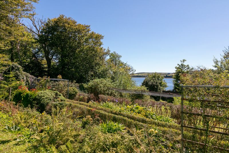 The walled garden has mature plants and a southerly aspect