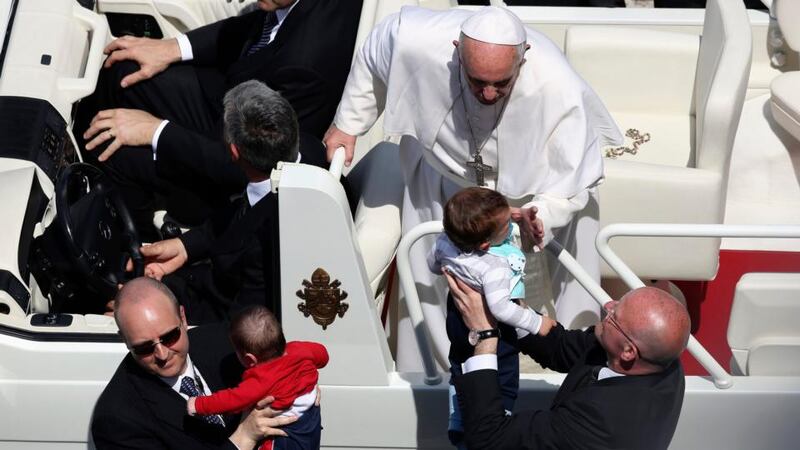 Pope Francis blesses children during a mass in Saint Peter’s Square at the Vatican today. Photograph: Alessandro Bianchi/Reuters