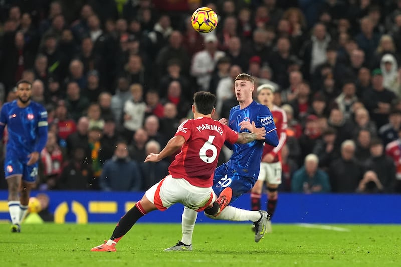 Manchester United's Lisandro Martínez challenges Chelsea's Cole Palmer during the Premier League match at Old Trafford, Manchester. Photograph: Martin Rickett/PA Wire.



