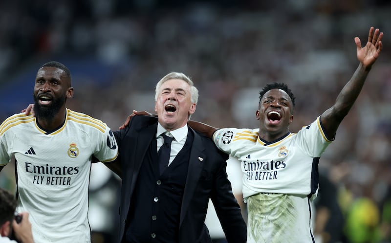 Real Madrid manager Carlo Ancelotti celebrates with Antonio Rüdiger   and Vinícius Junior. Photograph: Isabel Infantes/PA Wire