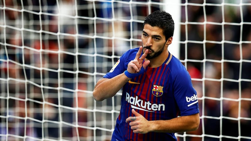 Luis Suarez reacts after scoring his goal. Photograph:  EPA