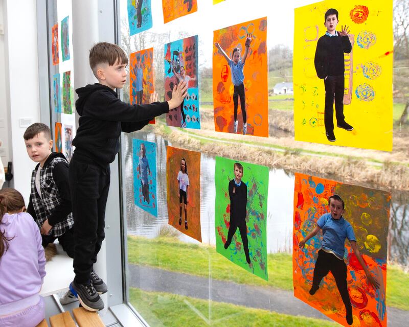 Pat Stokes from Carrick-on-Shannon checks out the portraits of the participating Traveller childre,  which is now part of the exhibition in Castlebar. Photograph: Brian Farrell