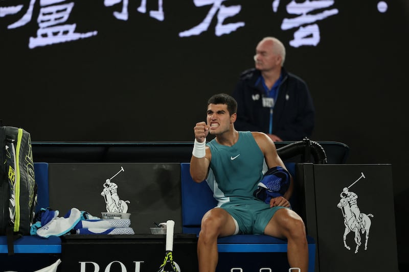 Spain's Carlos Alcaraz reacts after a point in a long rally against Serbia's Novak Djokovic during their men's singles quarter-final. Photograph:  Aadrian Dennis/AFP via Getty Images