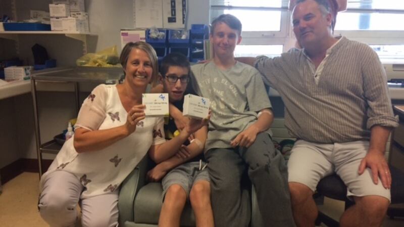 Maggie and Damian Kerins with their sons Mark and David at Tallaght hospital on their first day on Orkambi treatment. Photograph: Maggie Kerins.