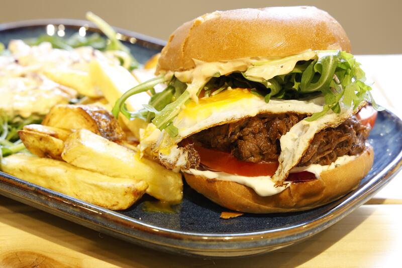 Brisket burger and fries. Photograph: Nick Bradshaw