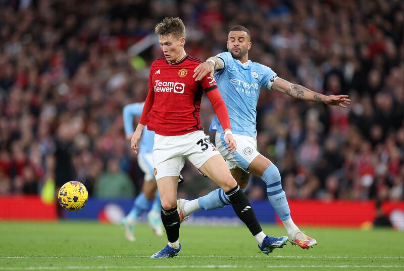 Scott McTominay of Manchester United and Kyle Walker of Manchester City battle for possession during the Premier League match. Photograph: Catherine Ivill/Getty Images