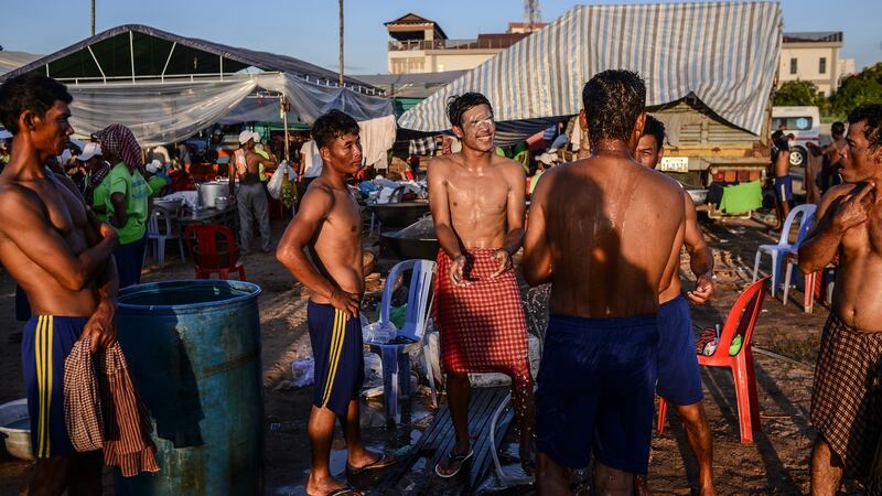 Participants in the annual Water Festival bathed after the final boat race in November 2016. Photoraph: Lauren Crothers