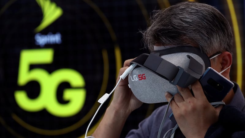 A man tests an LG 5G virtual reality device inside the LG booth at the Mobile World Congress. Photograph: Reuters