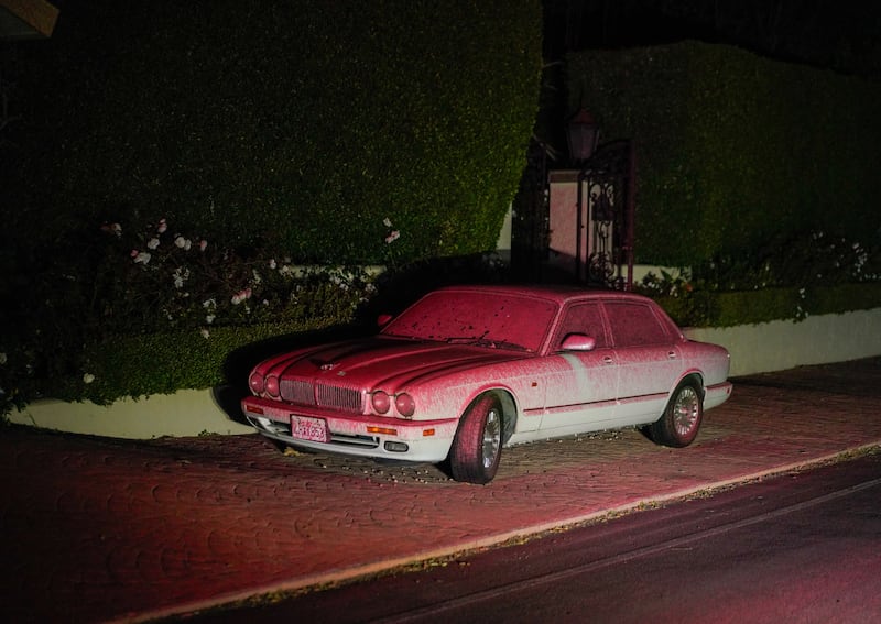 A car covered in fire retardant in the Mandeville Canyon neighbourhood in the aftermath of the fire. Photograph: Kyle Grillot/Bloomberg