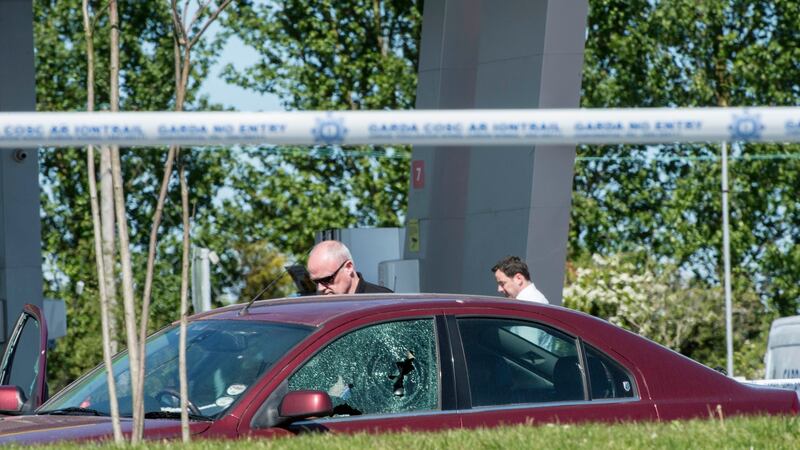 Forensic experts examine James 'Mago' Gately’s car after he was shot in an attack at a service station in north Dublin. Photograph: Brenda Fitzsimons