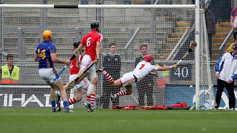 Séamus Callanan of Tipperary (14) scores the first goal of the game past Cork goalkeeper Anthony Nash at Croke Park. Photograph: Donall Farmer / Inpho