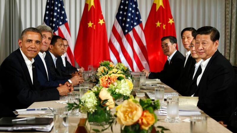 US president Barack Obama meets his  Chinese counterpart Xi Jinping (R) at The Annenberg Retreat. Photograph: Kevin Lamarque/Reuters