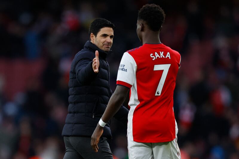 Arsenal's manager Mikel Arteta congratulates Bukayo Saka. Photograph: Ian Kington/AFP via Getty