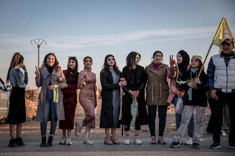 Girls and women line the streets of Hasaka, welcoming back civilian convoys who travelled to Tishreen Dam to support SDF soldiers fighting Turkish-backed militias. Photograph: Sally Hayden