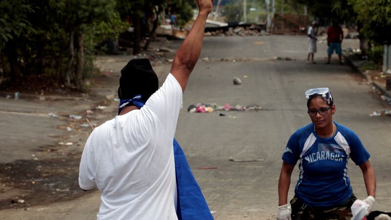 A university student holds up his arm during a protest over reform to the pension plans of the Nicaraguan Social Security Institute (INSS) in Managua, Nicaragua.  Photograph: Oswaldo Rivas/Reuters