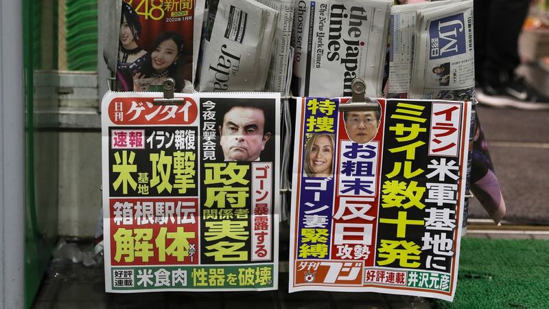 Carlos Ghosn features in a newspaper for sale in Tokyo on Wednesday. Photograph: Getty